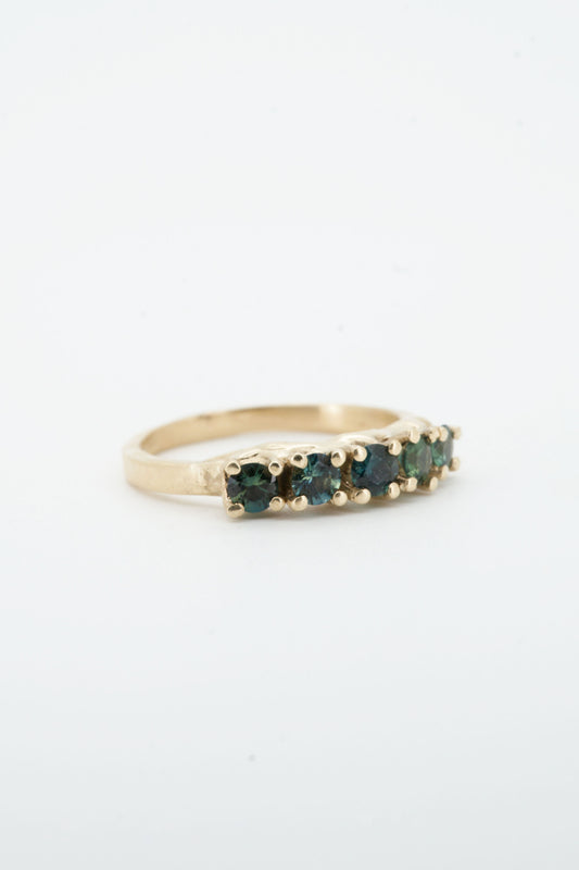 Teal sapphires + 9ct yellow gold