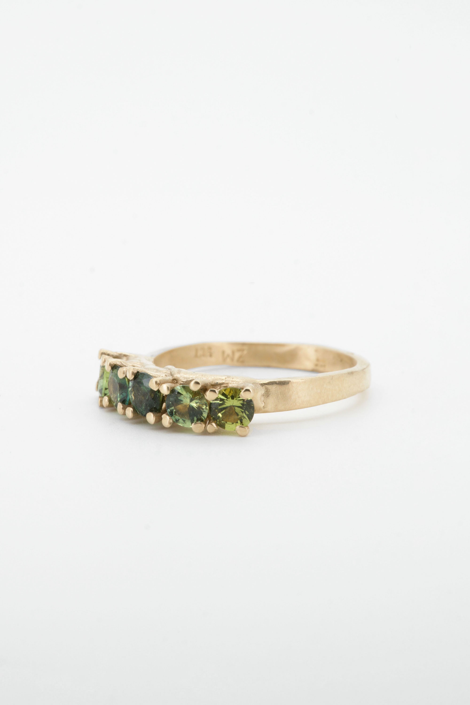 Green sapphires + 9ct yellow gold