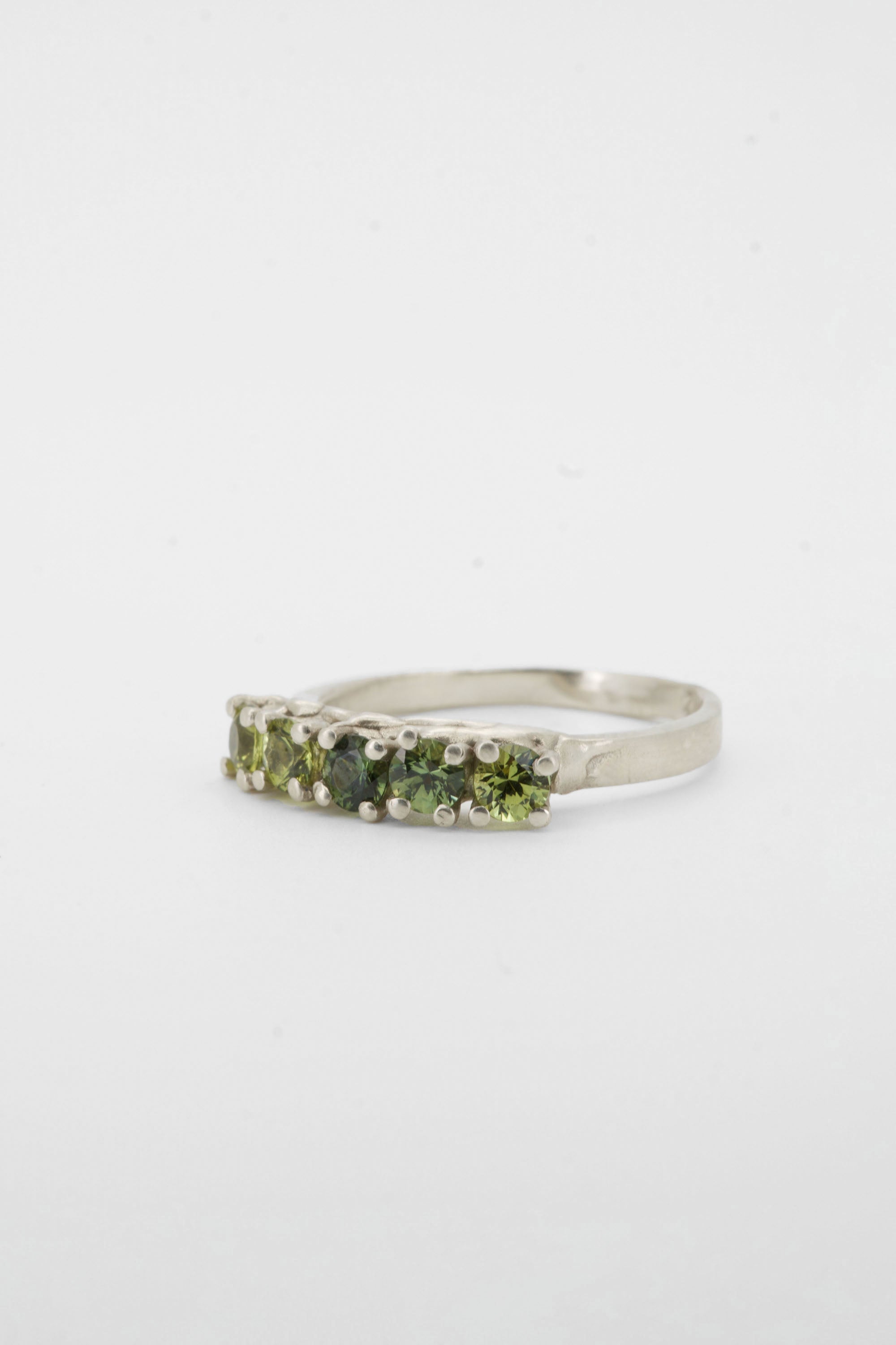 Green sapphires + 9ct white gold