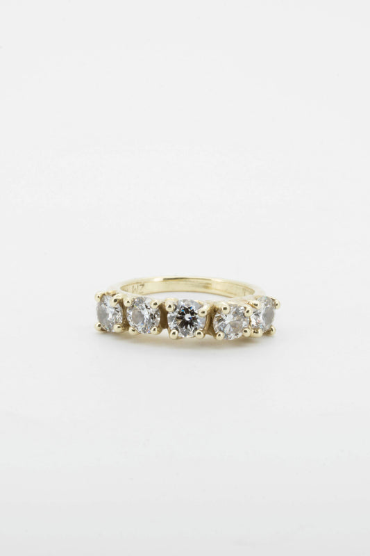 five brilliant diamonds set in solid 14 carat yellow gold