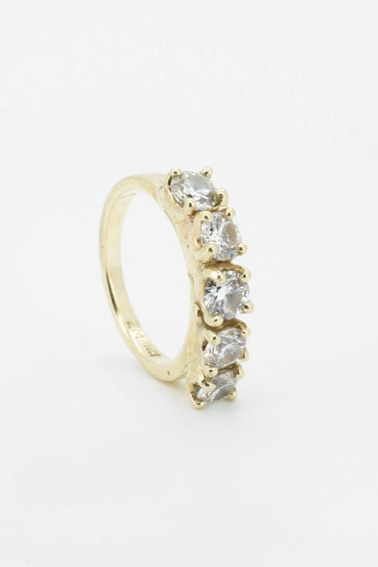 five brilliant diamonds set in solid 14 carat yellow gold