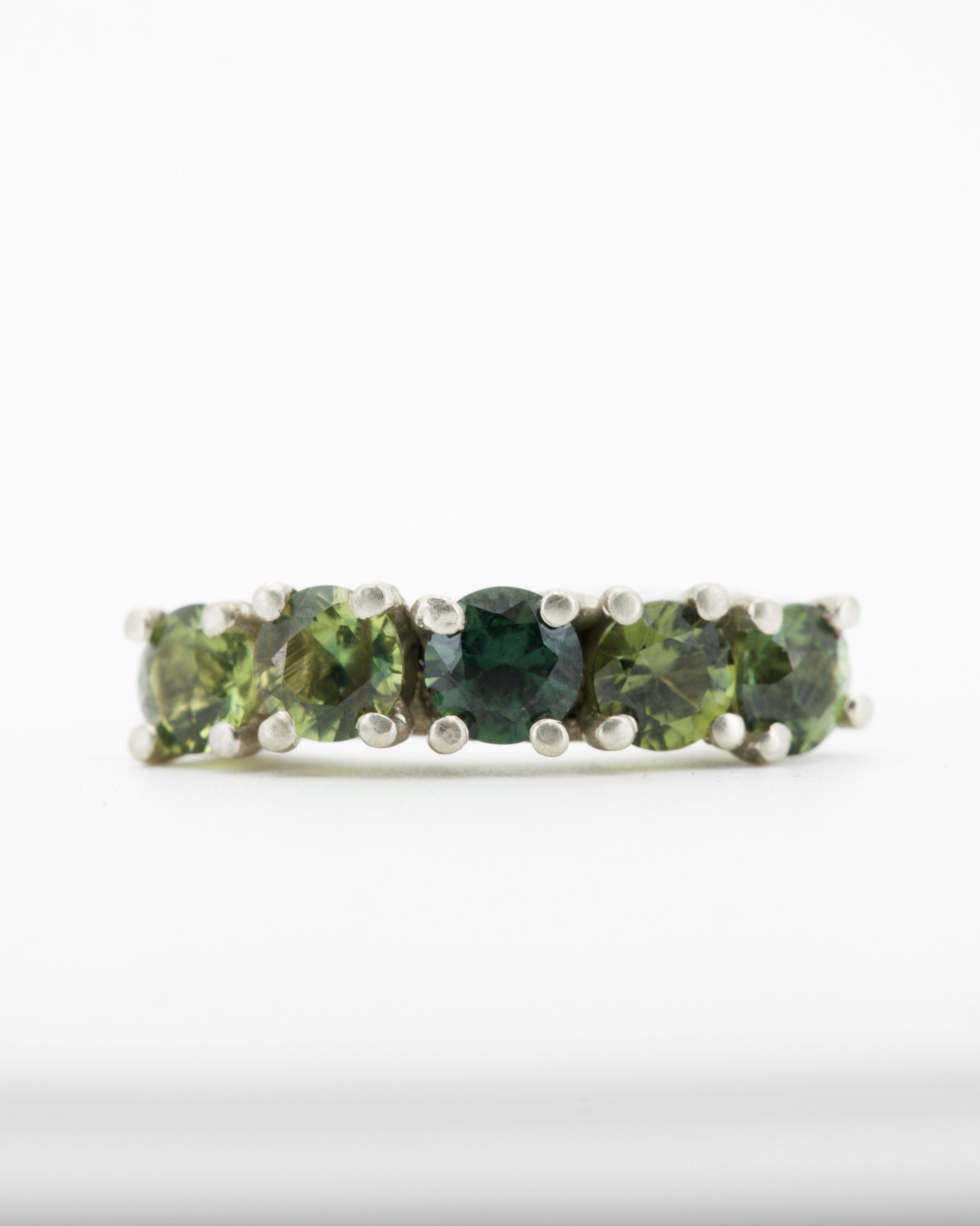 green sapphires + 9ct white gold