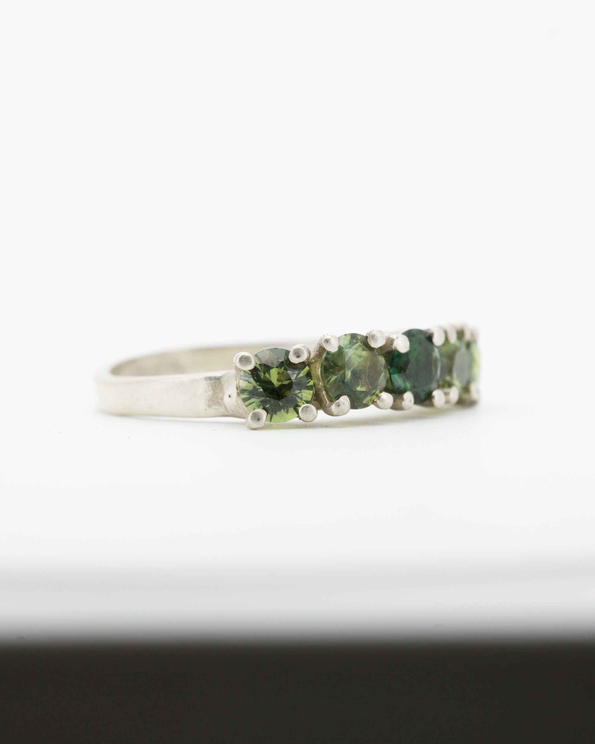 green sapphires + 9ct white gold