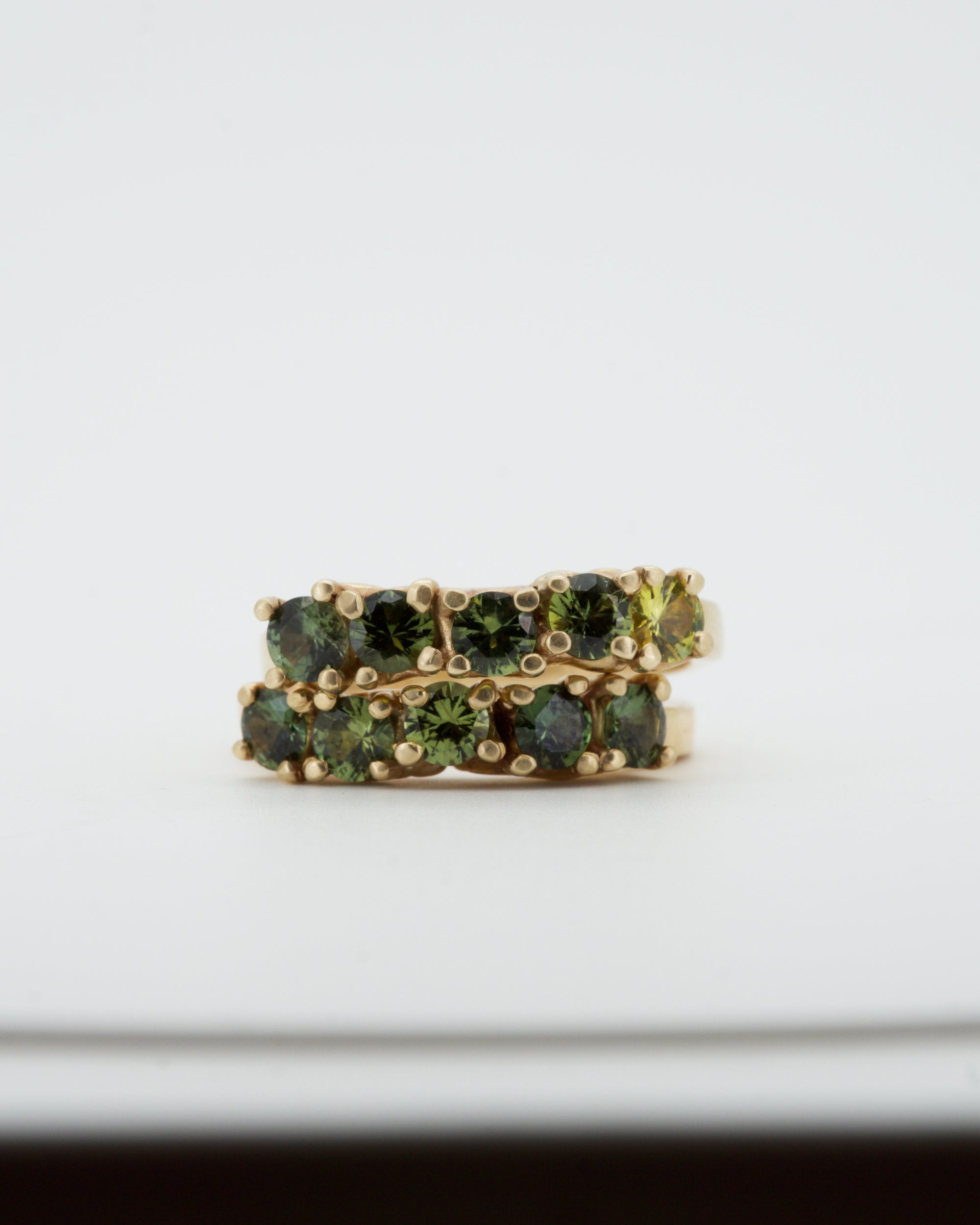 Green sapphires + 9ct yellow gold