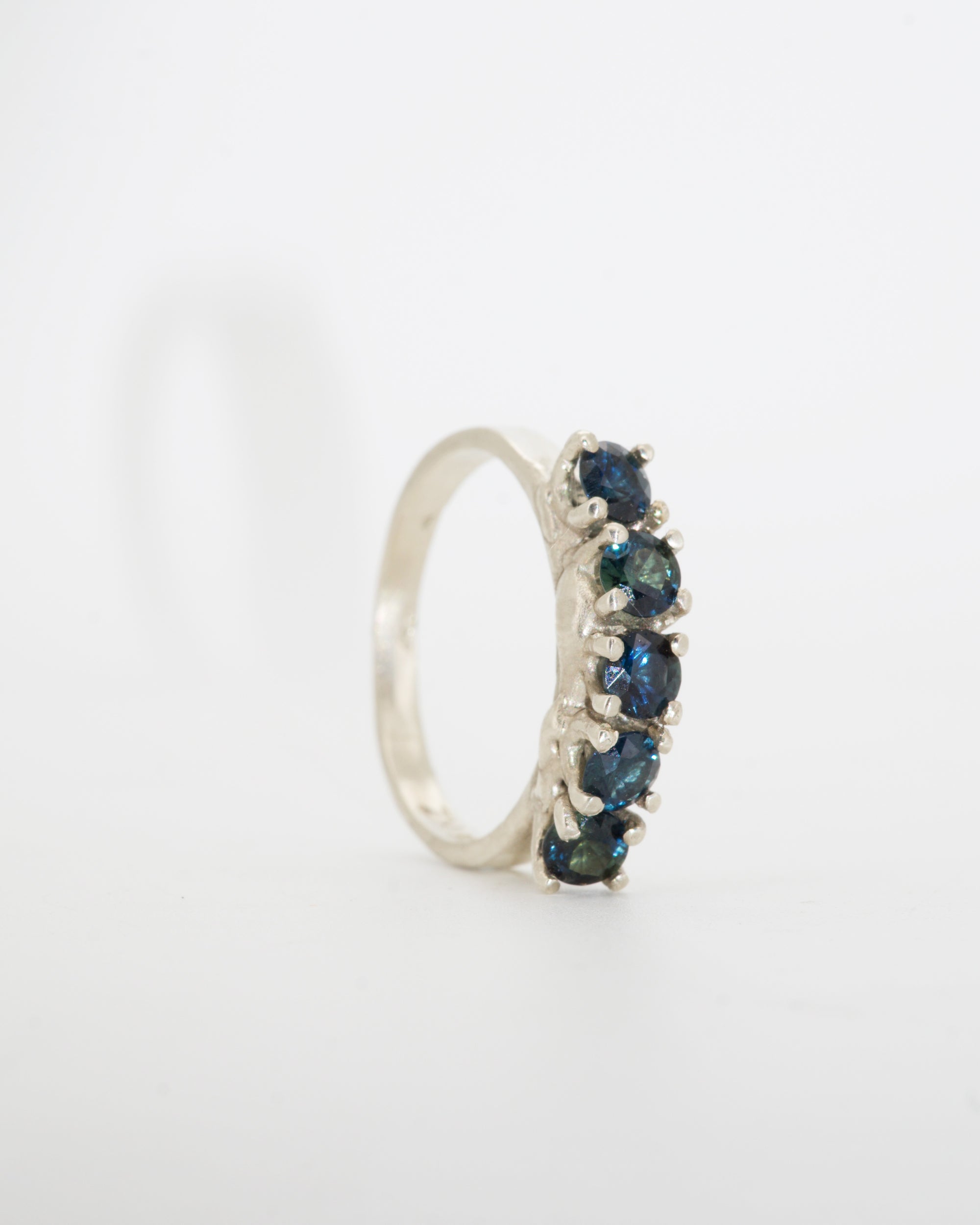 teal sapphires + 9ct white gold