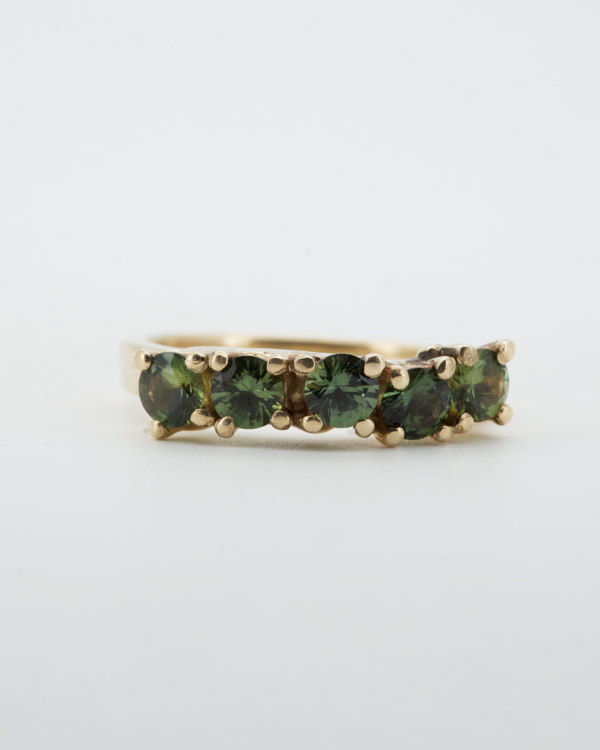 Green sapphires + 9ct yellow gold