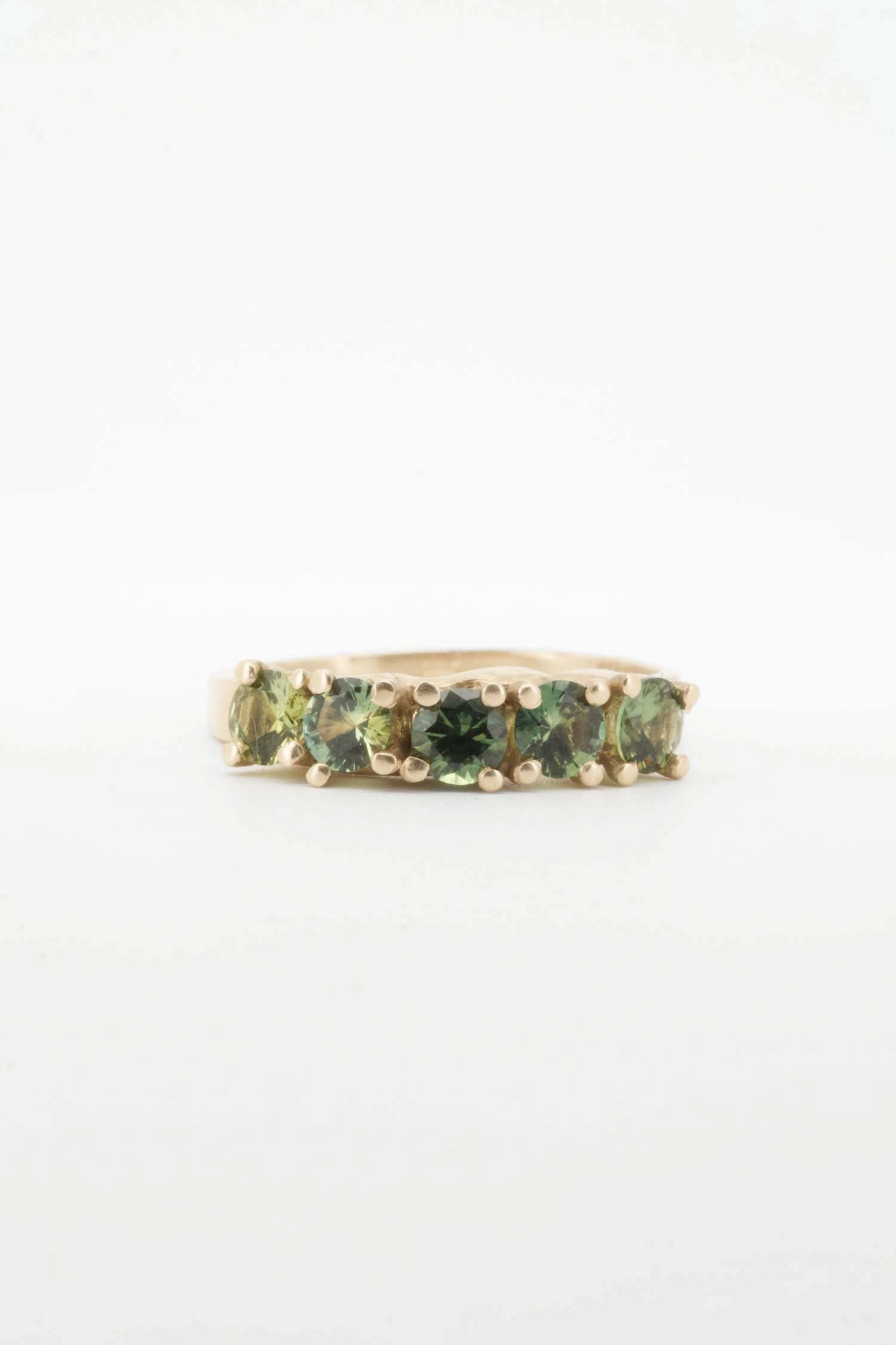 Green sapphires + 9ct yellow gold