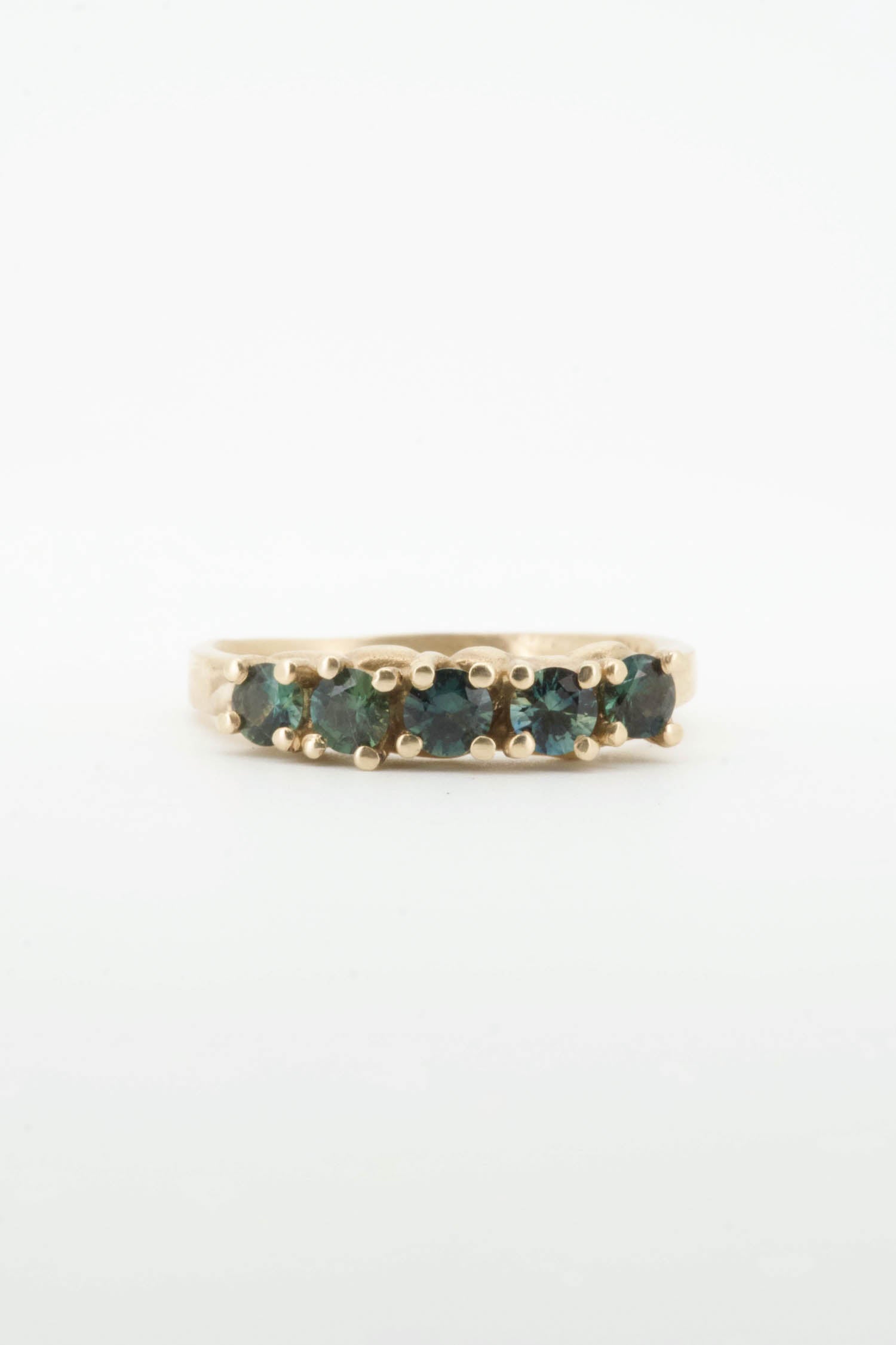 Teal sapphires + 9ct yellow gold